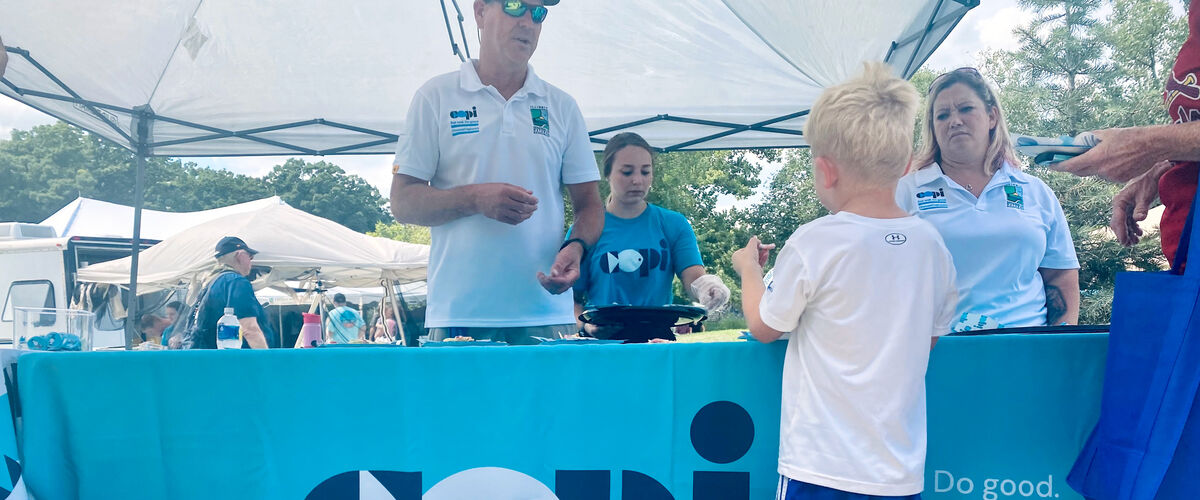 A young boy learning about fish